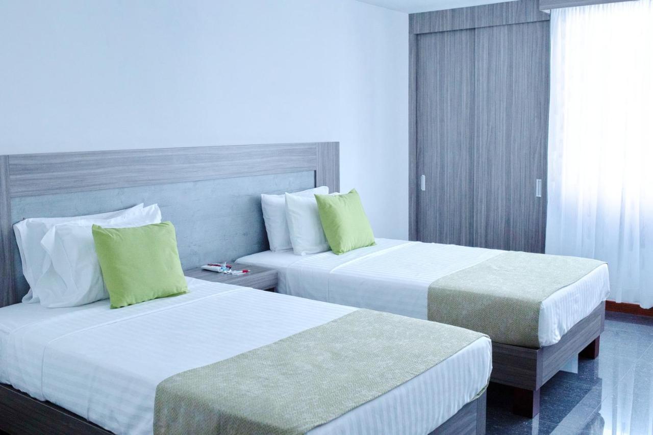 Hotel Be Suites Cali Bagian luar foto